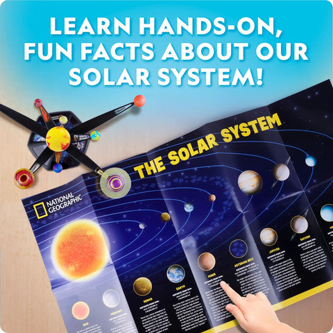 Child pointing at National Geographic poster with solar system chart beside Glow In The Dark Solar System Model Kit For Kids Ages 8-12 Build A 3D Planetary System With Movable Arms Paintable Planets Cool STEM Craft For Space Themed Bedrooms And Decor.