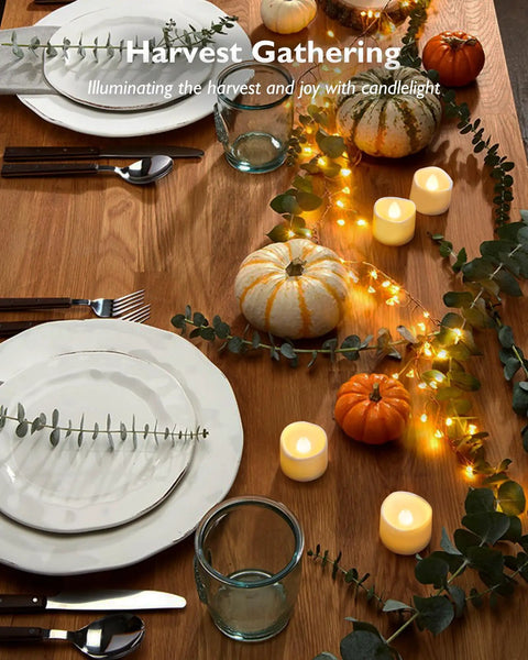 48 Pack Flameless LED Tea Lights With Flickering Warm White Glow, Ivory Bases on festive autumn table with pumpkins and plates