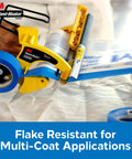 Advanced Masking Film for Hand Masker, 8 Rolls, 99 In x 90 Ft, being applied with hand masker on fabric surface.