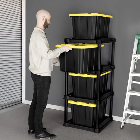 Man using Four Tier Vertical Tote Storage Rack For Garage Organization Holds Four 27 Gallon Bins Heavy Duty Plastic Organizer