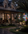 Solar Hot Air Balloon Lantern And Wind Chimes For Garden Outdoor Hanging Lights illuminating a porch at dusk.