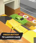 Close-up of Collapsible Racetrack Playset With 6 Mini Cars showing a green toy car at launch area with button and labels visible.
