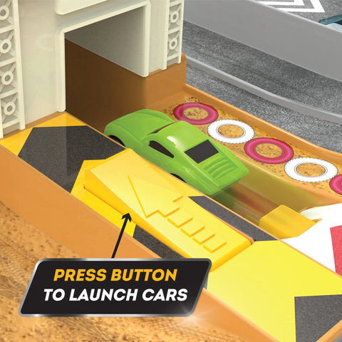 Close-up of Collapsible Racetrack Playset With 6 Mini Cars showing a green toy car at launch area with button and labels visible.