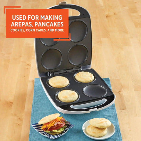 Imusa 4 Slot Electric Arepa Maker, 1200 Watt Nonstick Griddle For Fluffy Corn Cakes shown baking four corn cakes.