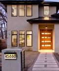 House exterior with Solar Powered House Numbers Address Plaque With Adjustable Solar Panel And Three Color Lighting for visibility