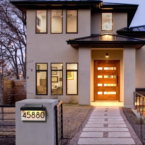 House exterior with Solar Powered House Numbers Address Plaque With Adjustable Solar Panel And Three Color Lighting for visibility