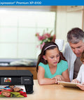 Slick Wireless Color All In One Inkjet Printer Featuring Killer Five Color Photo System For Crisp Documents And Legit Eight By Ten Prints Perfect For Your Home Office Setup Or Creative Project Workflow with family enjoying printed photo.