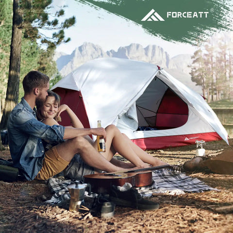 Couple sitting outside Two Person Waterproof And Windproof Camping Tent For All Season Backpacking Lightweight Aluminum Poles Quick Setup Dual D Shaped Doors And Two Vestibules Great For Hiking And Outdoor Adventures