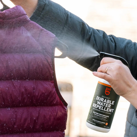 Revivex DWR Spray For Waterproof Jackets And Rain Gear Keeps Your Gear Dry And Gore-Tex Breathable With Water Beading Again sprayed on vest