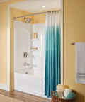 Retreat Collection 24 Inch Bathroom Towel Bar In Brushed Nickel Finish installed near tub with blue gradient shower curtain