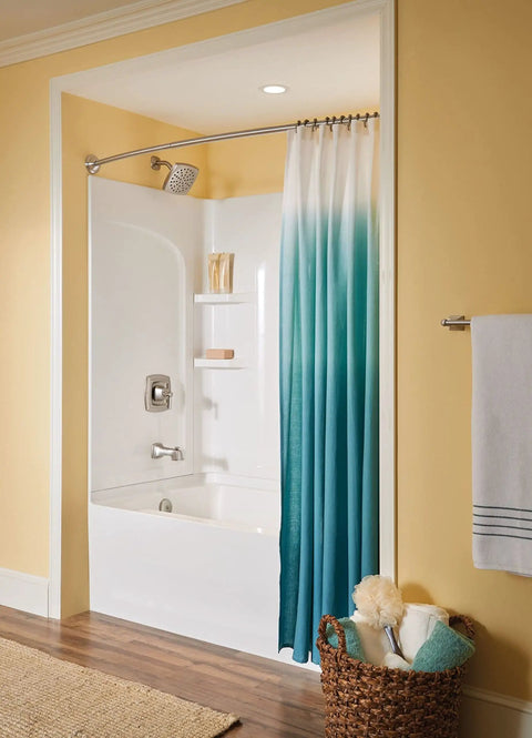 Retreat Collection 24 Inch Bathroom Towel Bar In Brushed Nickel Finish installed near tub with blue gradient shower curtain