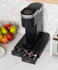 Two Drawer Single Serve Pod Organizer For 24 Pods Keurig Mini Compatible Black Countertop Coffee Caddy with a coffee maker on top