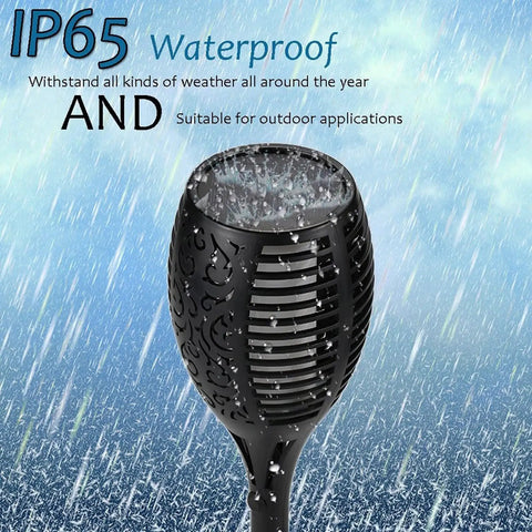 Close-up of Two Pack 33 Inch Solar Tiki Torches With 96 LED Flickering Flame Waterproof Outdoor Lights showing waterproof feature in rain.