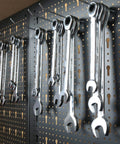 Wrenches hanging on pegboard of 47 Inch Workbench With Pegboard And Double Storage Platform, Multipurpose Tool Organizer
