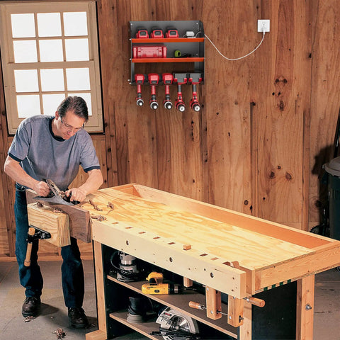 Heavy Duty Wall Mount Drill Organizer And Cordless Tool Storage Rack with tools and chargers in a workshop setting on a wooden wall