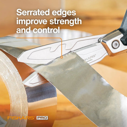 PowerArc 8 Inch Heavy Duty Shop Shears With Serrated Stainless Steel Blades cutting aluminum tape close-up.