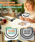 Person using Pro Grade 12X 30X Magnifying Glass With Light And Stand Long Arm Desk Magnifier for sewing embroidery project.