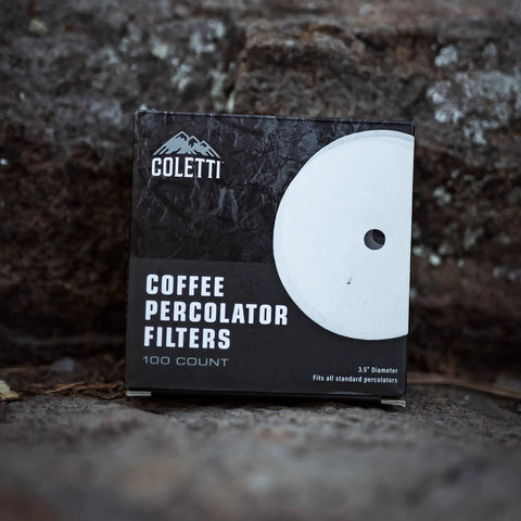 Premium Disc Percolator Coffee Filters For Campers And Home Brewers 3.75 Inch Mesh Paper Filters Pack Of 100 Fits Most Percolators Like Primula Eurolux Mereza And More For Cleaner Tasting Brew packaging on rocks.