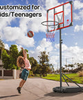 Kid playing basketball with Kids Adjustable Outdoor Basketball Hoop 4.82 To 8.53 Feet Portable Backyard Driveway Hoop With Enlarged Base And PC Backboard For Kids Teens And Youth Today