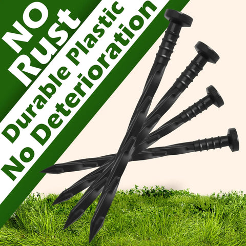 Landscape Edging Anchoring Spikes 6 Inch 30 Pack For Weed Barrier Lawn and Artificial Turf, plastic stakes shown on grass.