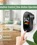 Plug In 3 In 1 Decibel Meter With Temperature And Humidity Reader mounted on wall, black compact digital sound meter with touch buttons.