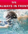 Swimmer wearing TYR swim cap and goggles, underwater action, promoting TYR's 'Always in Front' campaign.