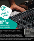 Beast 3000W Voltage Converter Transformer manual next to audio mixer console; displays setup instructions.