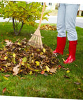 Person using Portable Garden Hand Rake with Wear Resistant Tines Lightweight And Easy To Handle for leaf gathering in yard