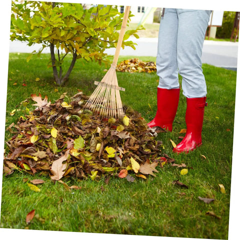 Person using Portable Garden Hand Rake with Wear Resistant Tines Lightweight And Easy To Handle for leaf gathering in yard