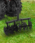 32 Inch Disc Plow Harrow For ATV And UTV With Universal 2 Inch Receiver Mount on grass field
