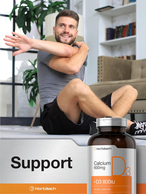 Man exercising at home with a bottle of Calcium 600 Mg With Vitamin D3 Coated Caplets for Women and Men, Vegetarian, Non GMO.