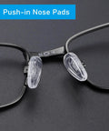 Close-up of replacement silicone nose pads for Oakley sunglasses Socket 5.0 and 5.5, clear silicone on black frame.