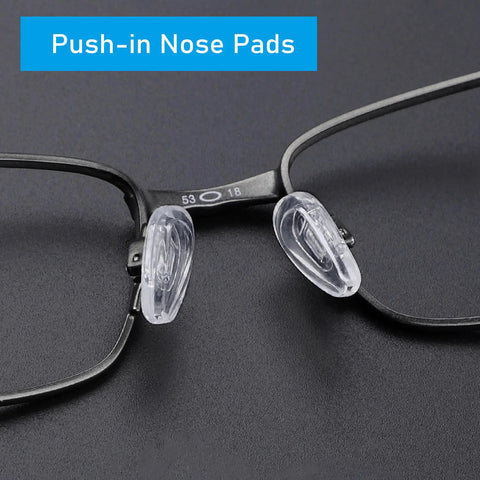 Close-up of replacement silicone nose pads for Oakley sunglasses Socket 5.0 and 5.5, clear silicone on black frame.