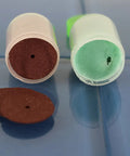 Red and green sanding discs from 100 Piece Rotary Tool Accessory Set For Dremel And Other Rotary Tools With Diamond Burrs Mounted Stones.