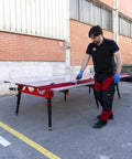 Man using Heavy Duty Adjustable Tile Table For Large Format Ceramic Sheets Extending 43 To 59 Inches outdoors, highlighting its functionality.