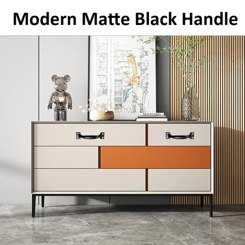 Modern matte black handle installed on a beige and orange cabinet, showcasing the 12 Pack 4 Inch Vintage Barn Door Pulls In Black Metal Screw In Handles For Cabinets And Drawers Heavy Duty Rustic Gate Knobs For Kitchen Furniture And Outdoor Use.