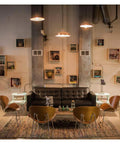 Vintage-style room with pendant lights resembling Vintage Edison Style LED Filament Bulb 40W Equivalent E26 Non Dimmable 450 Lumens.