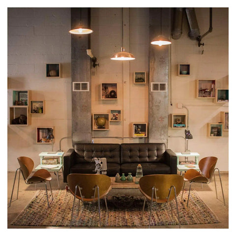 Vintage-style room with pendant lights resembling Vintage Edison Style LED Filament Bulb 40W Equivalent E26 Non Dimmable 450 Lumens.