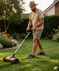 Man using lawn mower wearing Workhorse Heavy Duty Lawn Aerator Shoes With Spikes For Easy Soil Breathing And Better Water Infiltration