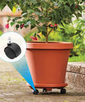 Five Pack 1.5 Inch Swivel Caster Wheels With M8 Circlip Stem 8mm By 20mm attached to a planter in a garden