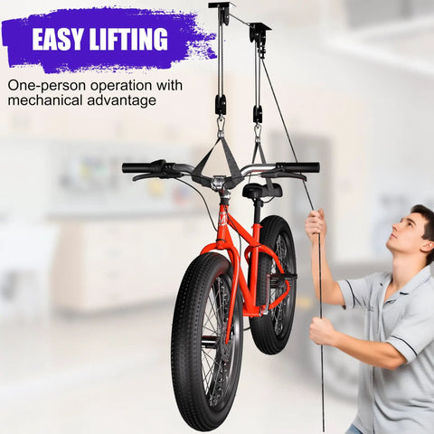 Person using 2 Pack Heavy Duty Bike Hoist Pulley System For Garage Ceiling Storage, Easy Lift For Ebikes And Bikes, Ladders, Snowboards.