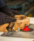Three Quarter Inch Radius Rounding Over Router Bit With Quadra-Cut Design in use on raw wood in workshop setting.