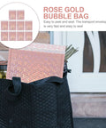 Rose gold bubble mailer partially inside black bag, labeled 'Rose Gold Bubble Bag', showcasing easy peel and seal feature