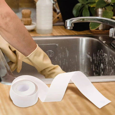 Super Easy White PVC Caulking Tape For Bathtub And Window Gaps Peels Sticks And Seals To Stop Water Leaks Without Messy Tools on kitchen counter.