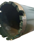 Close-up of a silver diamond core drill bit for concrete with segmented outer teeth.