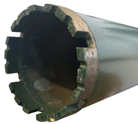 Close-up of a silver diamond core drill bit for concrete with segmented outer teeth.