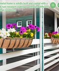 Side view of Two Pack 24 Inch Railing Planter Boxes with Coconut Liners For Outdoor Balcony Porch Fence And Patio No Fuss Easy Hang Deck Flower Baskets Includes Zip Ties Sturdy Metal Troughs For Vibrant Seasonal Plants, installed on railing with flowers
