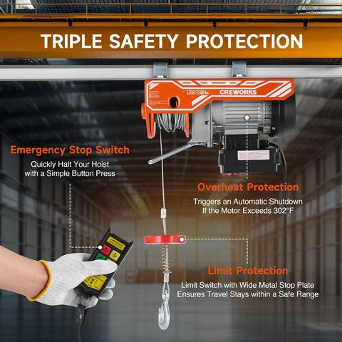 CreWorks electric hoist mounted to a ceiling beam, orange unit with remote control and lifting hook (2500 lbs)