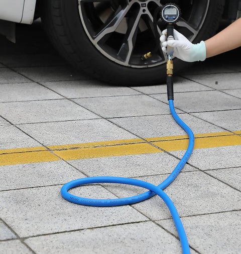 Person using Hybrid Air Hose 1/2-Inch ID 100-Foot Long with 3/8-Inch MNPT Solid Brass Fittings to check tire pressure.