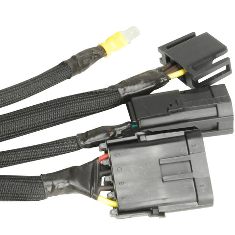 Black automotive wire harness with connectors, cables, and protective sleeving, showing Quick Fix Tape 1 Inch By 12 Foot Self Curing Waterproof Silicone Insulation Tape For Extreme Temperatures And Easy Multi Use Repairs At Home Auto Marine And Industrial Projects applied on joints